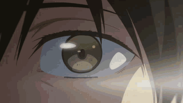 a close up of a person 's eye with a reflection of a teddy bear