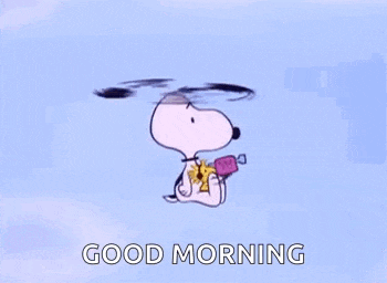 snoopy is flying through the air while holding a candy and a flower .