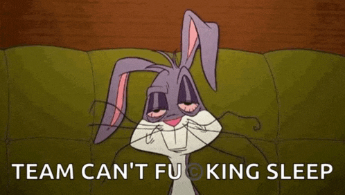 bugs bunny from looney tunes is laying on a couch with his eyes closed