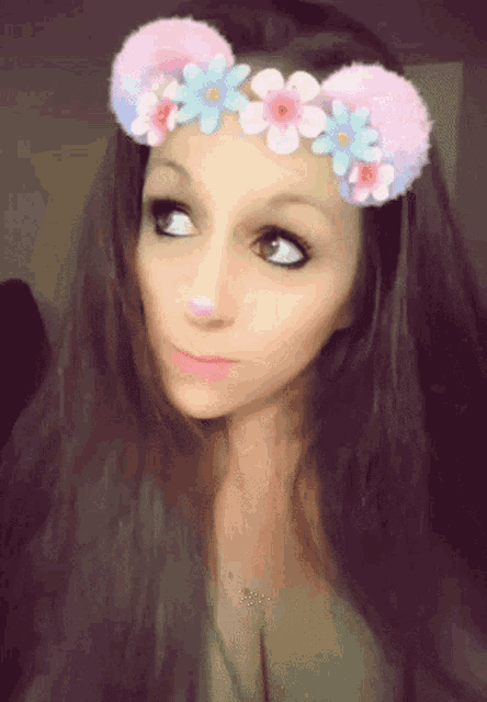 a girl with a flower crown on her head