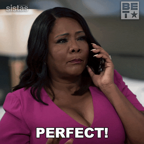 a woman in a pink shirt is talking on a cell phone and says " perfect "