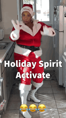 a woman dressed as santa claus in a kitchen with the words holiday spirit activate