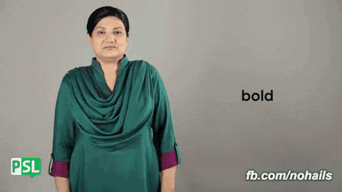 a woman in a green dress says bold on a gray background
