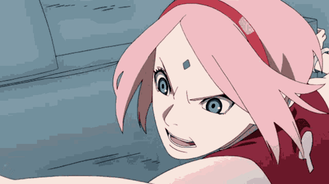 a girl with pink hair and green eyes is looking at something