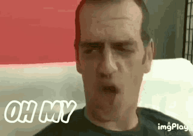 a man making a funny face with the words oh my behind him