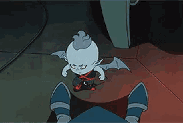a cartoon character with wings is standing next to a person 's feet .