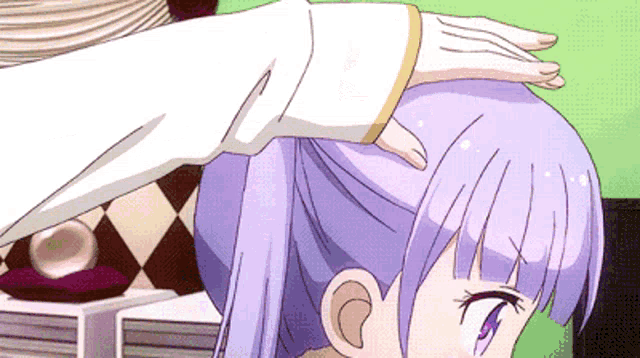 a girl with purple hair is being touched by another person 's hand