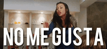 a woman stands in front of a sign that says " no me gusta "