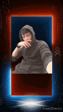 a man in a black hoodie is taking a selfie in a powerdirector frame