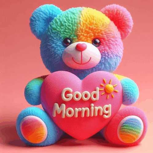 a colorful teddy bear is holding a heart that says good morning