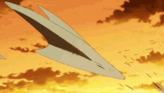 a paper airplane is flying through a cloudy orange sky