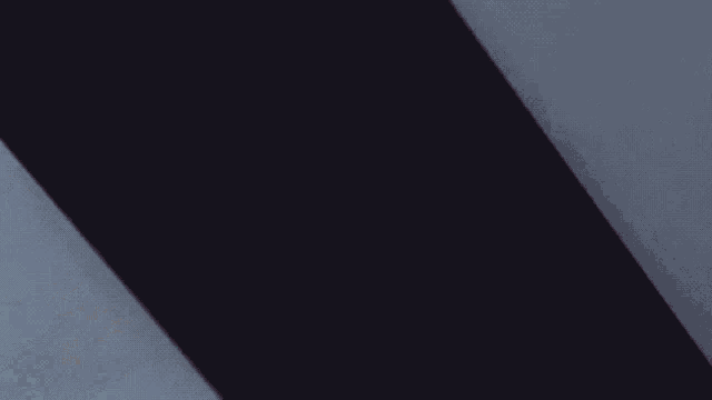 a room with a white couch and a drawing of the letter r