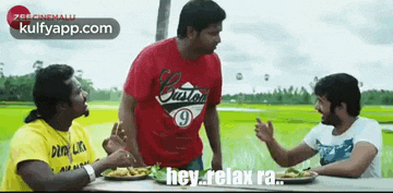 a group of men are sitting at a table with plates of food and one of them is saying hey relax ra .