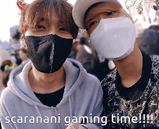 two men wearing face masks with the words scaranani gaming time written below them