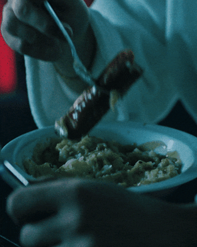 a person is holding a piece of food in their hand