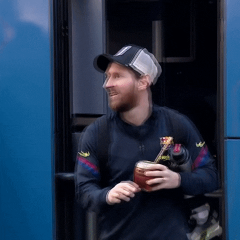 a man with a beard wearing a black shirt that says ' reebok ' on the sleeve