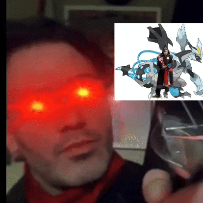 a man with red eyes is holding a glass with a picture of a pokemon on it