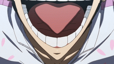 a close up of a person 's mouth with their tongue out