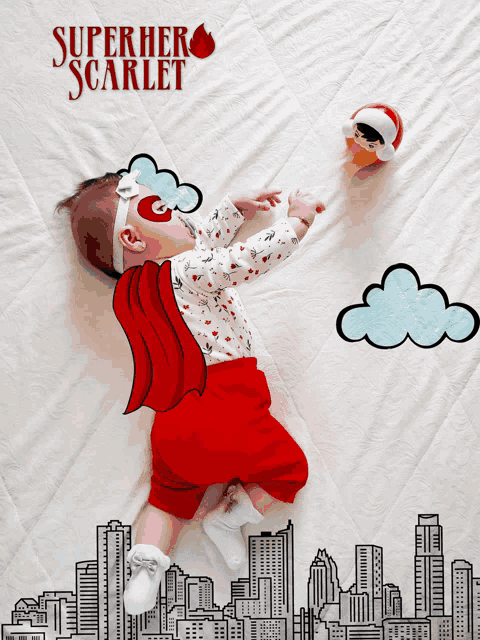 a baby is laying on a blanket with a superhero scarlet poster behind him