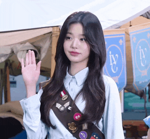a girl scout wearing a badge that says i 'v
