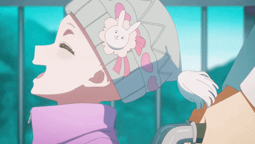 a girl wearing a hat with a bunny on it is looking up