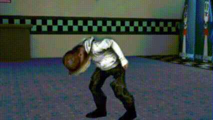 a man in a white shirt is standing on a blue floor