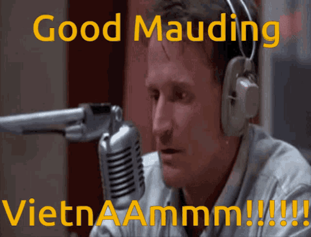 a man wearing headphones is talking into a microphone with the words good mauding vietnaamm !!!