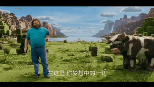 a man in a blue shirt stands in a field with a cow in the background
