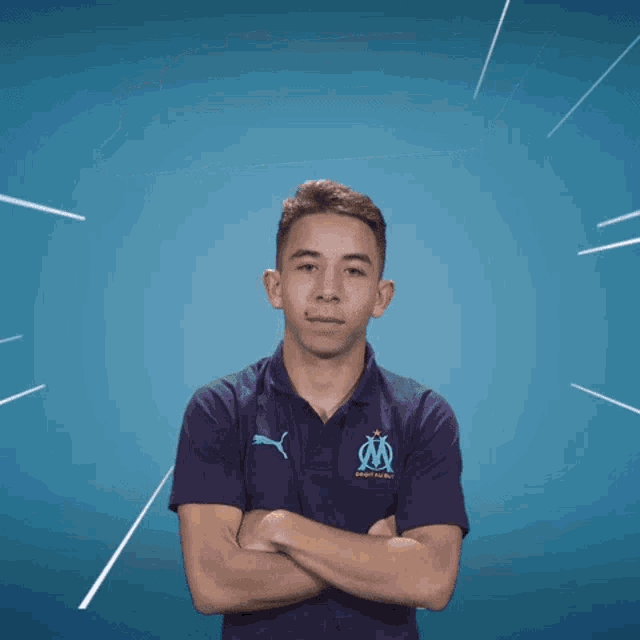 a young man with his arms crossed stands in front of a victory royale sign