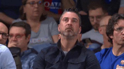 a man wearing a blue shirt that says ' barcelona ' on it