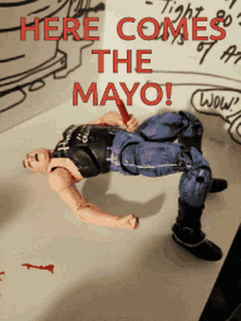 a toy figure is laying on its back with the words here comes the mayo