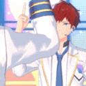 a man with red hair is wearing a white suit and tie and giving a thumbs up .