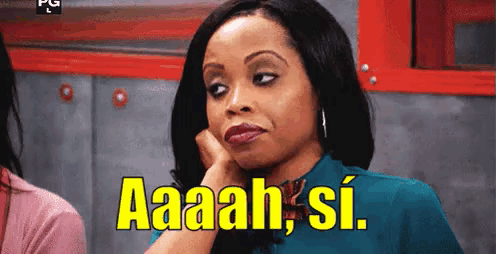 a woman is making a funny face and saying aaah si