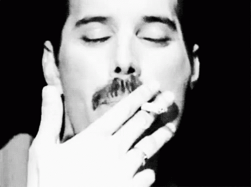 Freddiemercury Repetelinda Irritar Cigarro GIF - Freddie Mercury Repeat Honey Annoy GIFs
