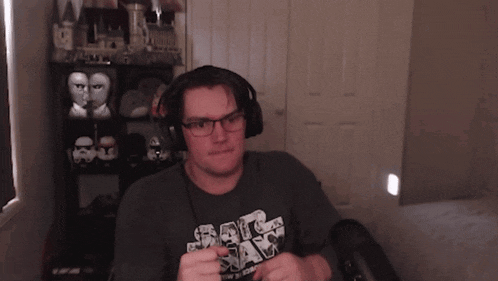 a man wearing headphones and a shirt that says " big ass "