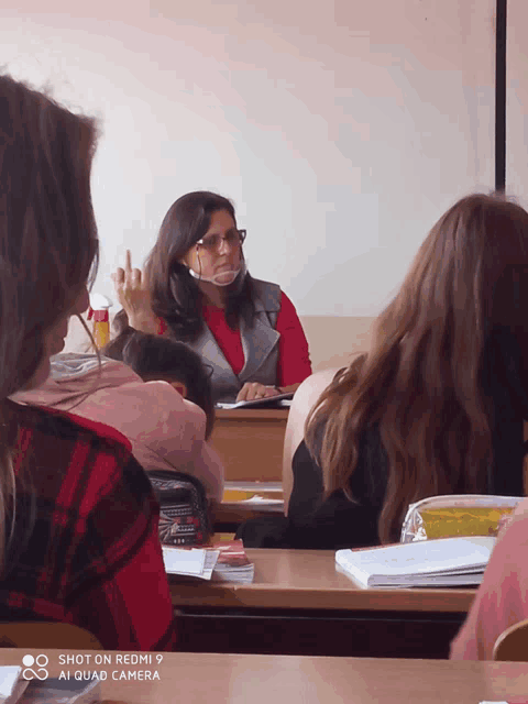 a shot on redmi 9 ai quad camera shows a woman giving a presentation