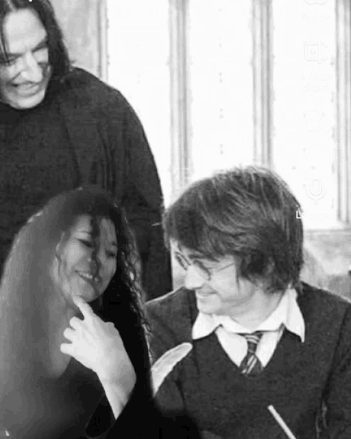 a black and white photo of harry potter and his friends