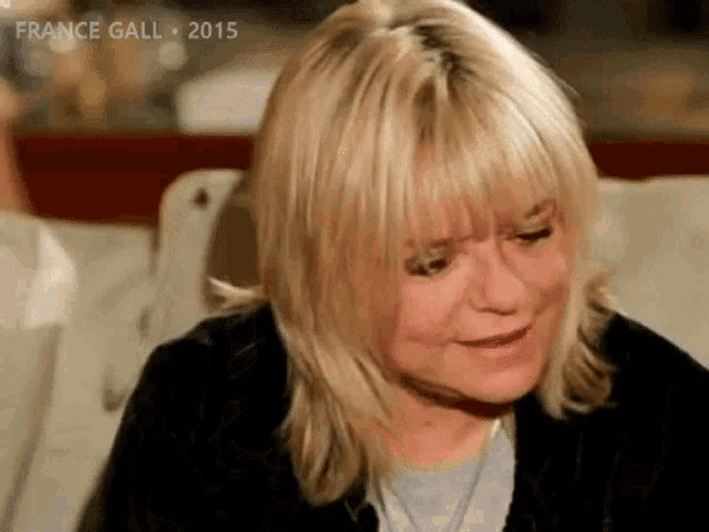 a close up of a woman 's face with the year 2015 on the bottom right