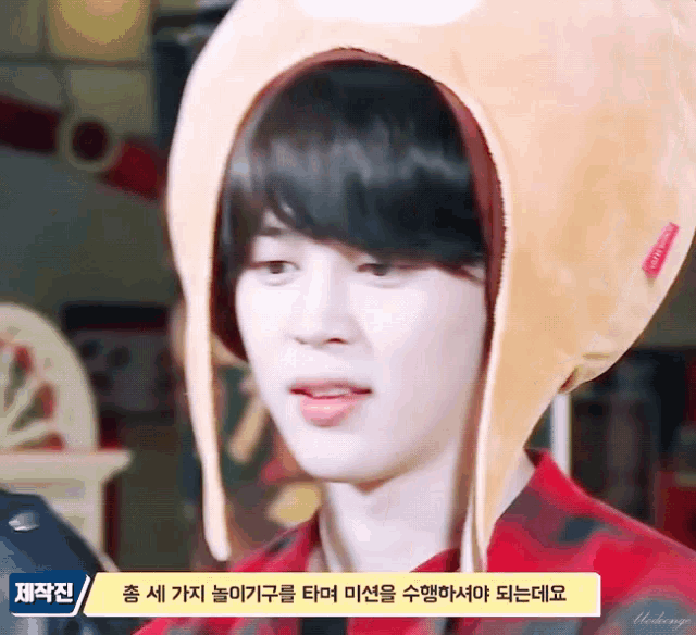a young man wearing a hat that says ' hamburger ' on it