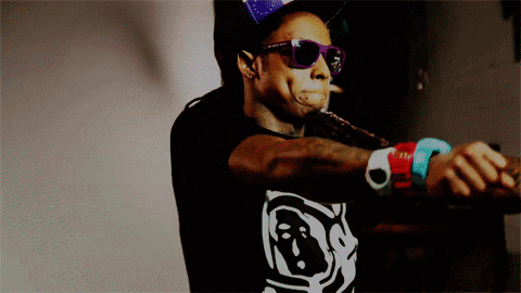 a man wearing sunglasses and a hat has a tattoo on his face