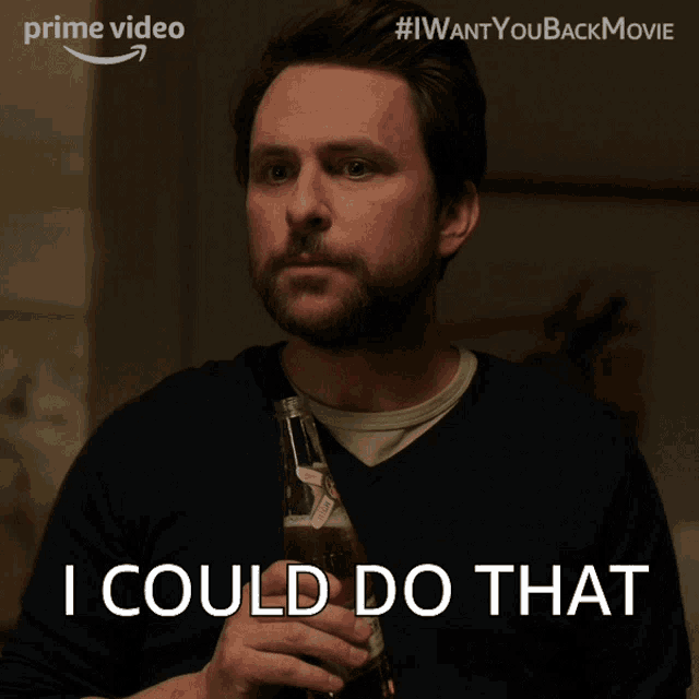 a man holding a bottle of beer with the words i could do that below him