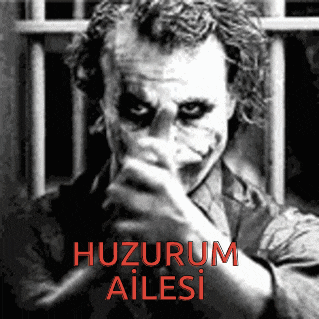 a black and white photo of the joker with the words huzurum ailesi behind him