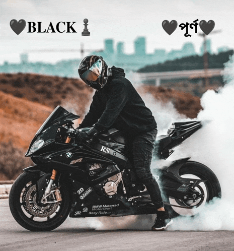 a man riding a black motorcycle with the words black i above him