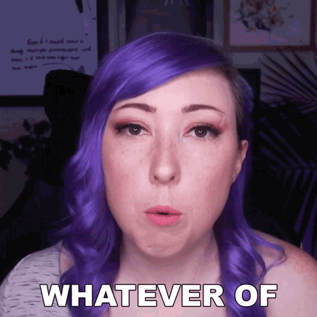 a woman with purple hair says " whatever of " in front of her face