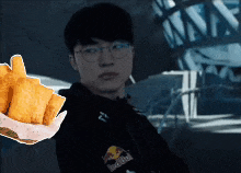 a man wearing glasses is holding a basket of food