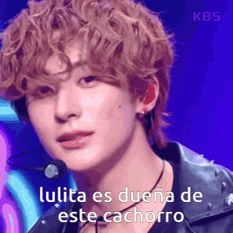 a close up of a person with the words lulita es duena de este cachorro