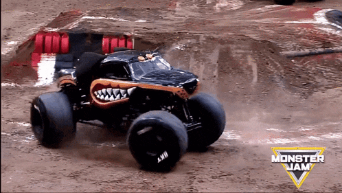 a monster jam logo can be seen in the background of a monster truck