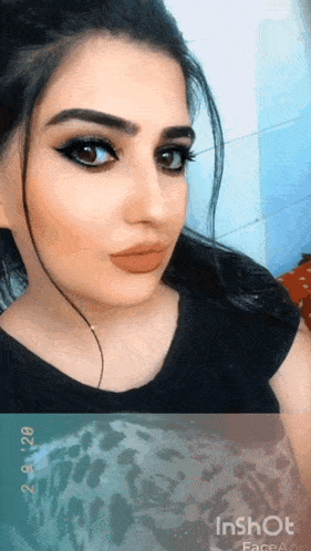 a close up of a woman 's face with inshot face app visible