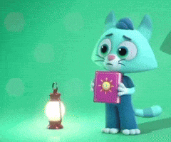a cat is holding a book with a sun on it