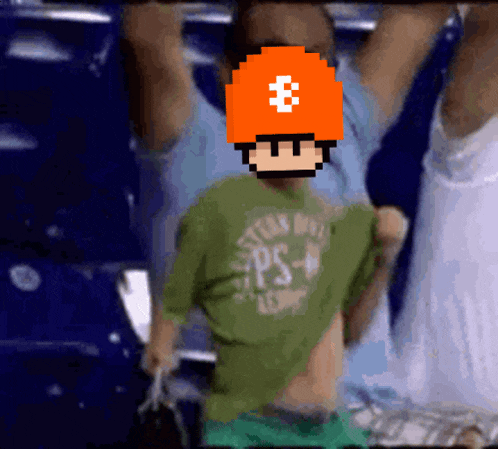 a pixelated image of a boy wearing a green shirt and an orange hat